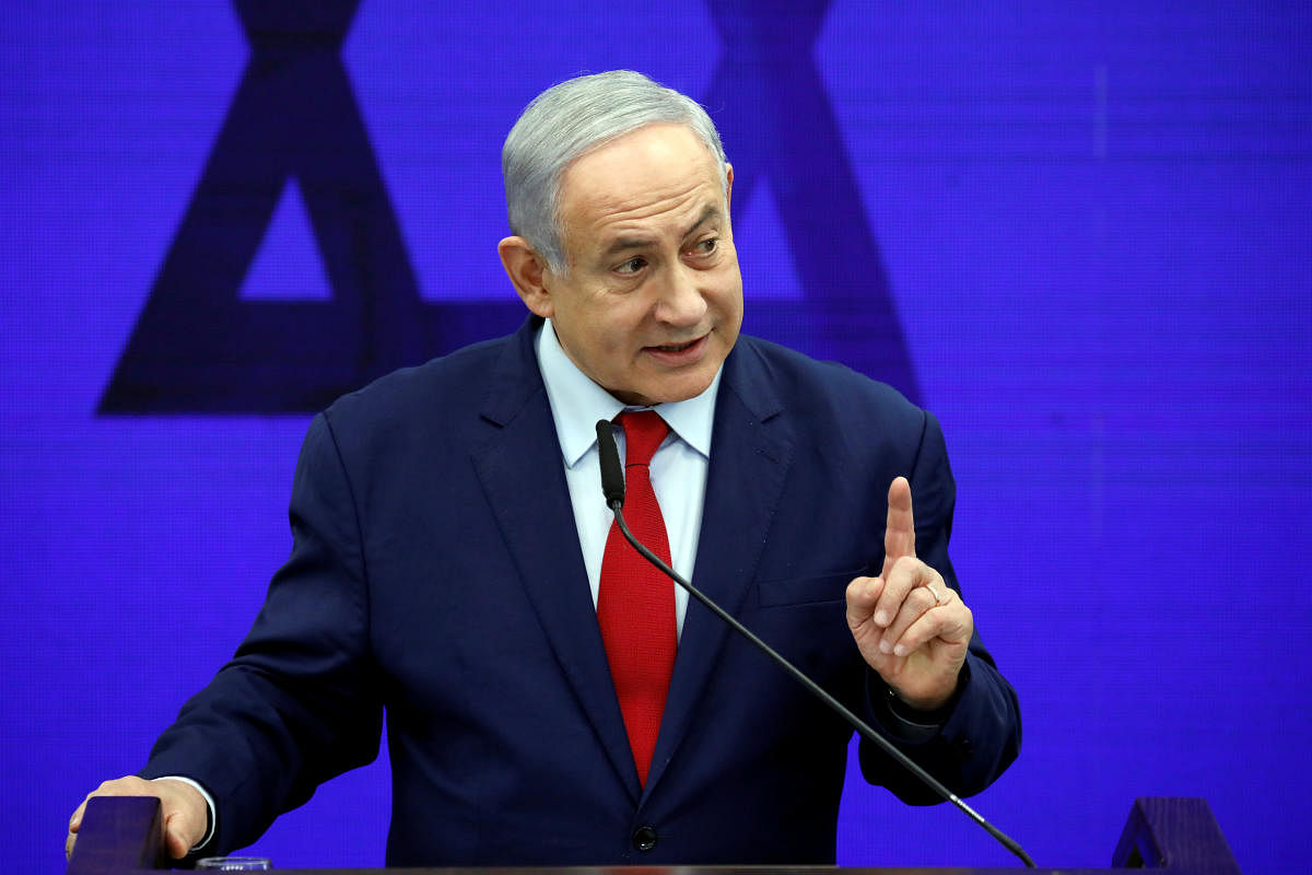 Hours earlier, bodyguards rushed Netanyahu to shelter in the southern Israeli city of Ashdod when the sirens sounded during a Tuesday evening rally, a week ahead of a general election. (Reuters Photo)