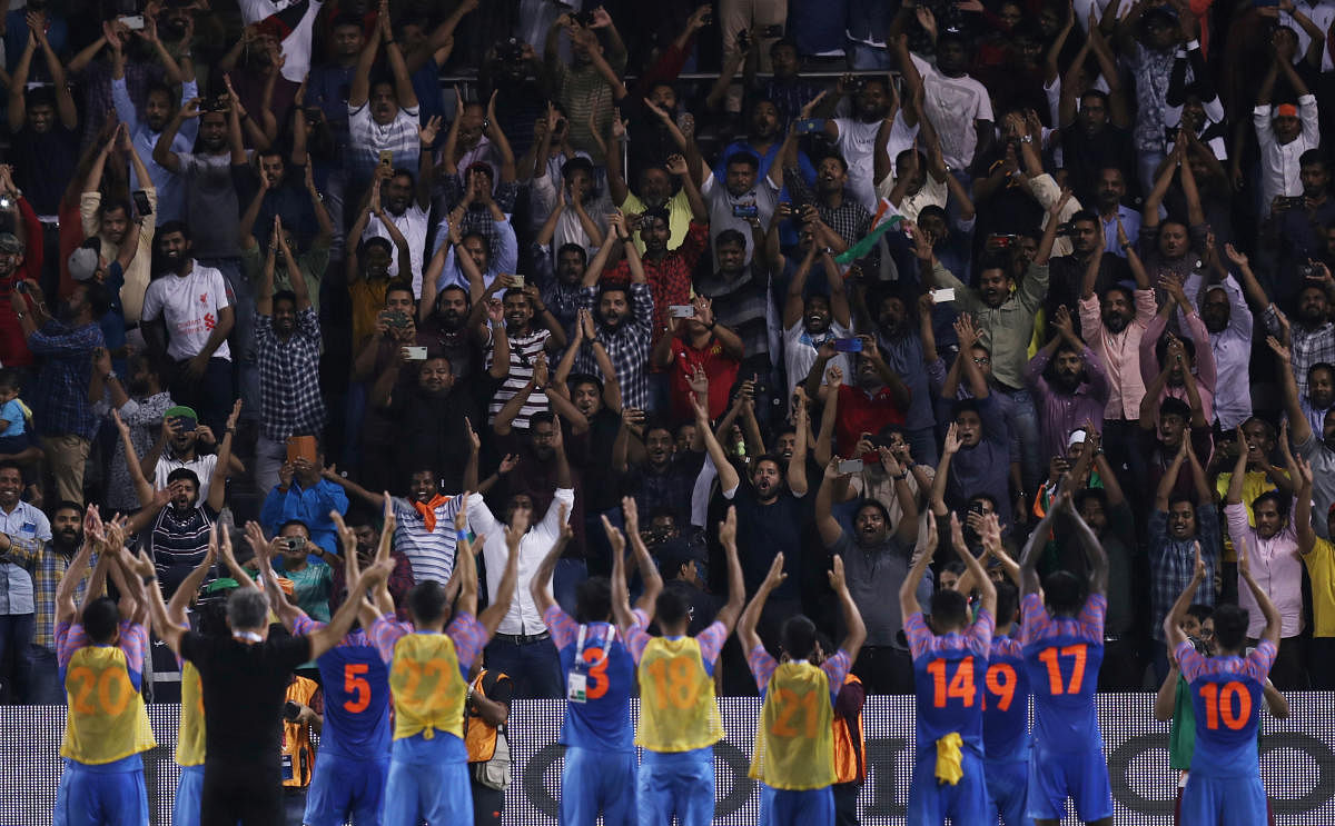 India celebrate with fans after the match. (REUTERS/Ibraheem Al Omari)