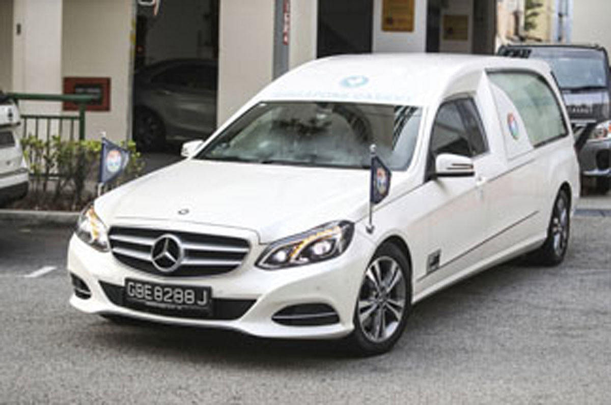 A hearse carrying the body of former Zimbabwe President Robert Mugabe leaves the Singapore Casket Funeral Parlour for the airport in Singapore. AP/PTI