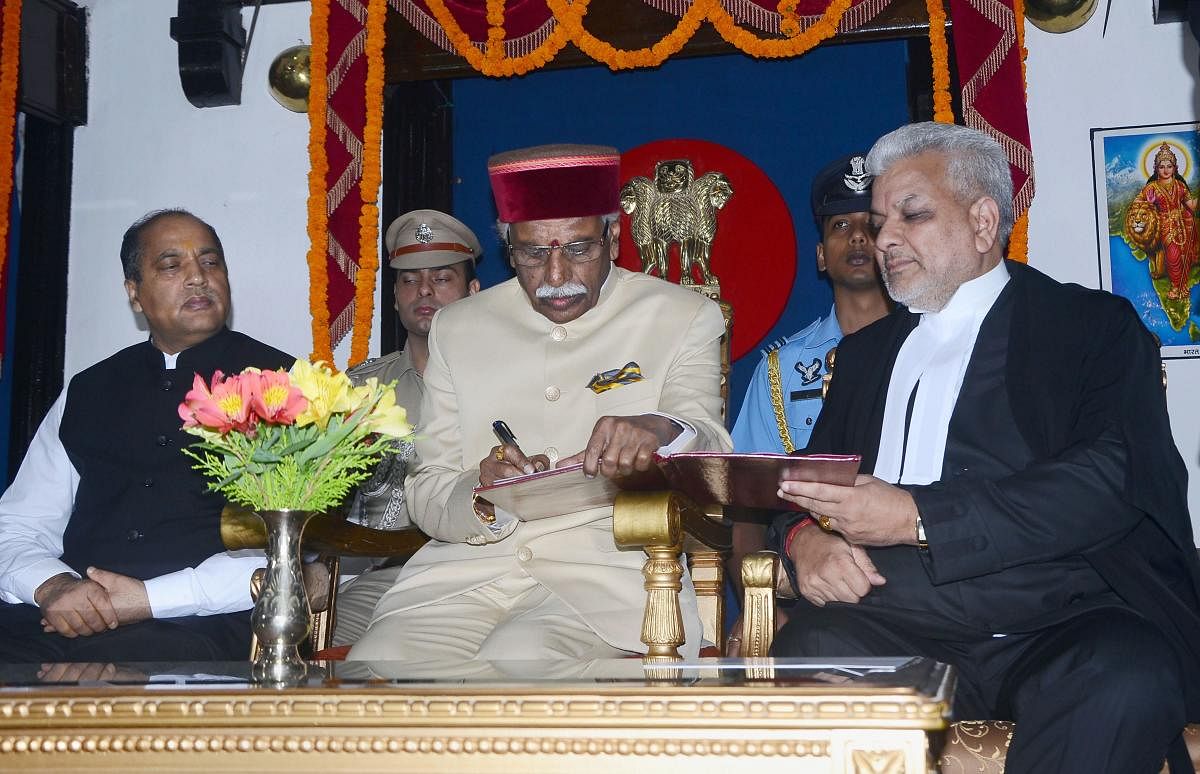 Himachal Pradesh High Court Justice Dharam Chand Chaudhary administers the oath of office to Himachal Pradesh Governor Bandaru Dattatreya. PTI Photo