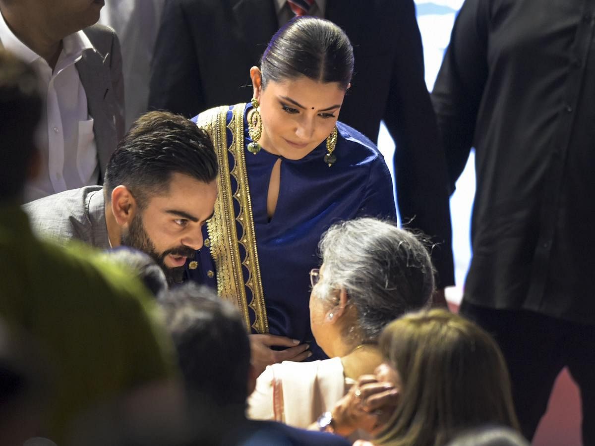 Virat Kohli and his wife Anushka Sharma interact with the family members of the late politician-cum-sports-administrator Arun Jaitley, at an event to rename Feroz Shah Kotla Stadium as 'Arun Jaitley Stadium', during DDCA's Annual Awards function, in New Delhi. PTI