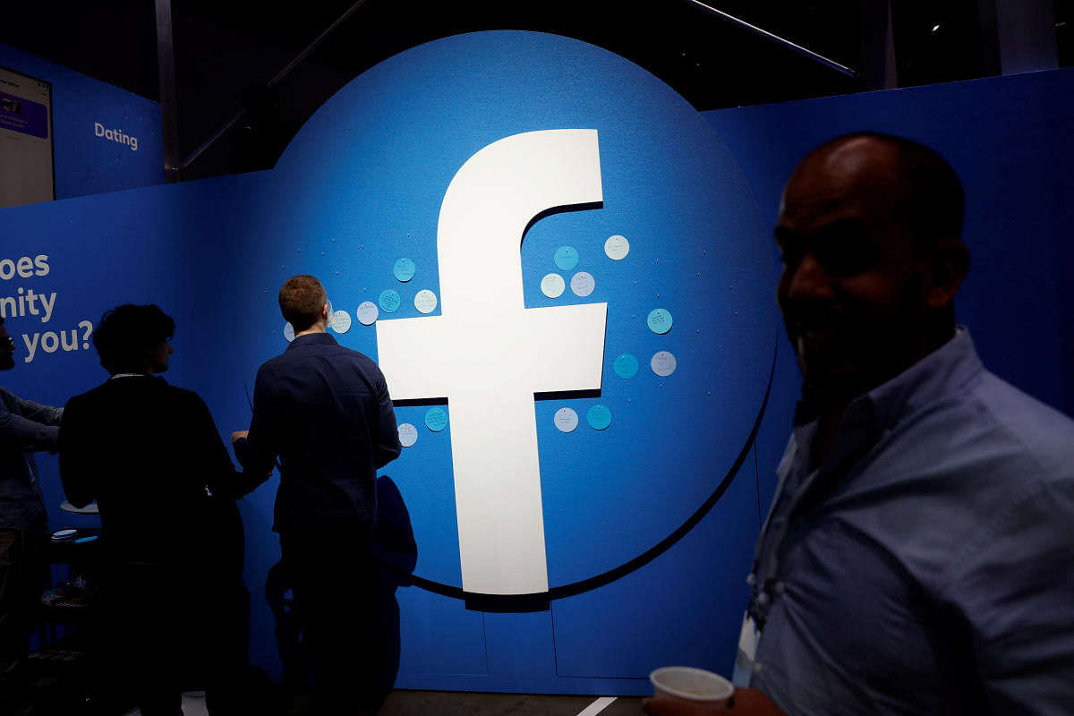 Attendees walk past a Facebook logo in San Jose, California, U.S. (Reuters Photo)