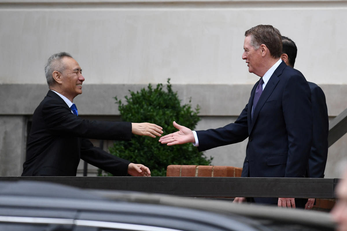 Chinese Vice Premier Liu He shakes hands with U.S. Trade Representative Robert Lighthizer outside the office of the U.S. Trade Representative. (Reuters Photo)