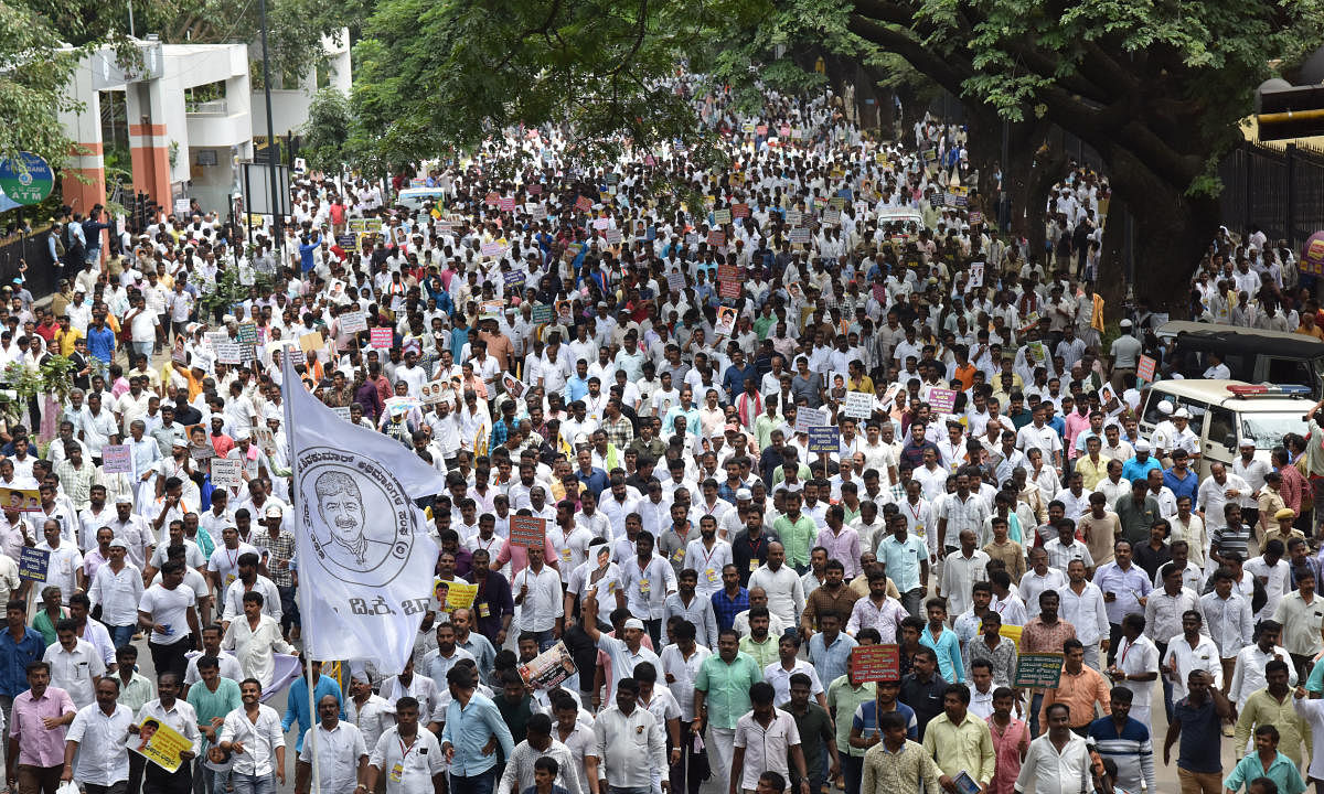 Members of the Vokkaliga Sangha participate in a protest rally in solidarity with Congress leader D K Shivakumar in Bengaluru on Wednesday. DH Photo/B K Janardhan