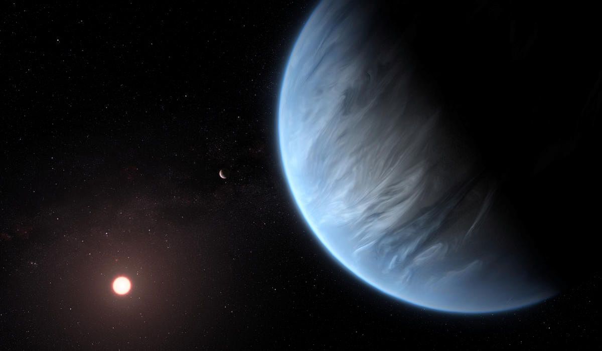 An artist's impression released by NASA on September 11, 2019 shows the planet K2-18b, its host star and an accompanying planet. (Courtesy ESA/Hubble/M. Kornmesser/NASA Handout via REUTERS)
