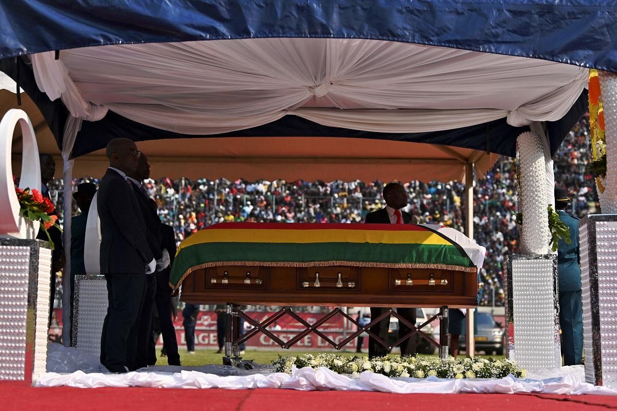 The casket containing the body of Zimbabwe's late former president, Robert Mugabe sits at the centre of the historic Rufaro stadium in Harare. (AFP Photo)