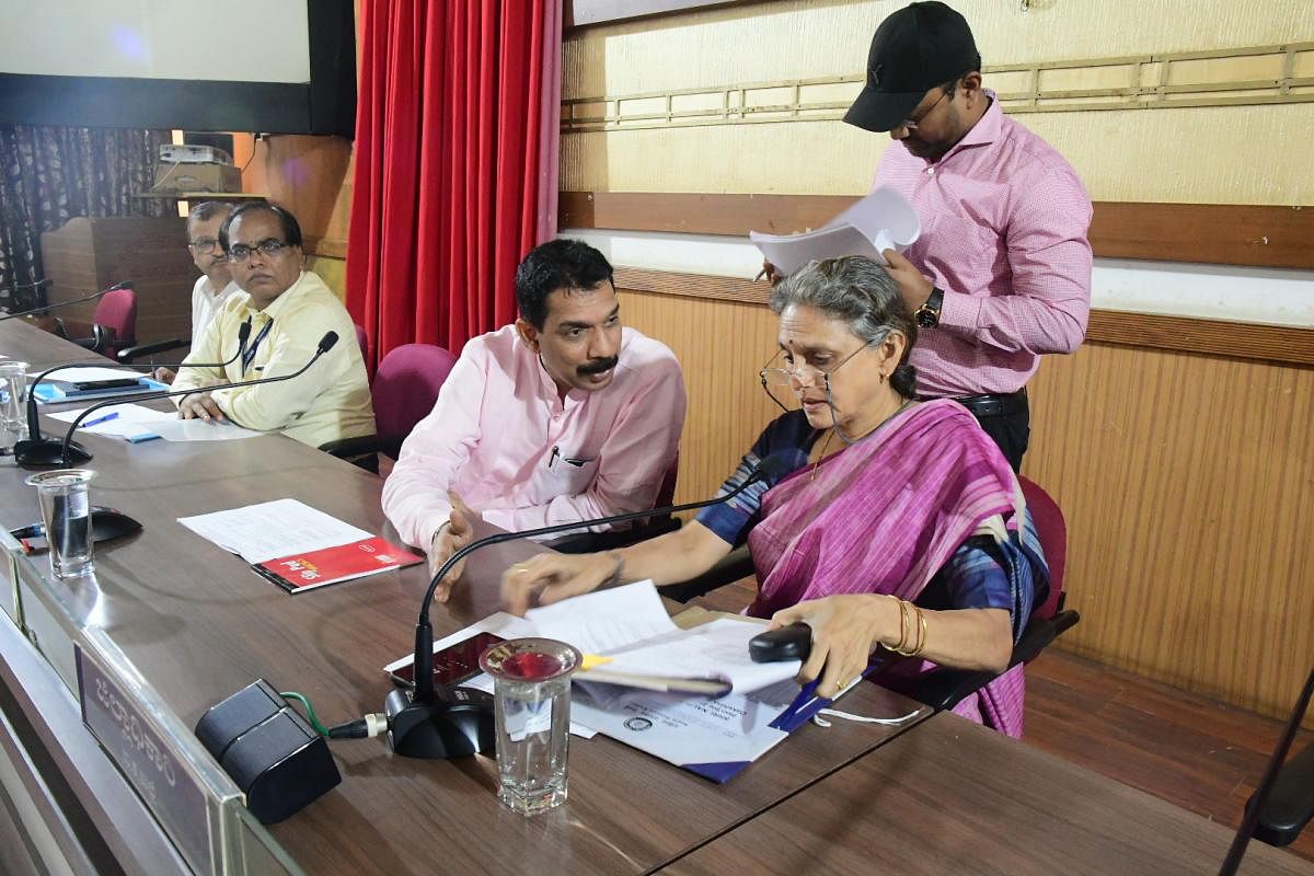 MP Nalin Kumar Kateel speaks to Mysore Divisional Railway DRM Aparna Garg during a meeting held in Mangaluru on Friday. DH PHOTO