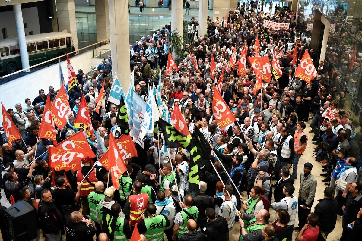CGT Union members gather inside Paris public transports operator headquarters La Maison de la RATP in Paris on September 13, 2019, during a one-day strike of RATP employees over French government's plan to overhaul the country's retirement system. (Photo