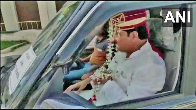 Feroz Khan put on the attire of a groom and left for Rampur in a car decorated with flowers. His supporters, dressed as wedding guests, accompanied him in other vehicles. (Twitter/ANI)