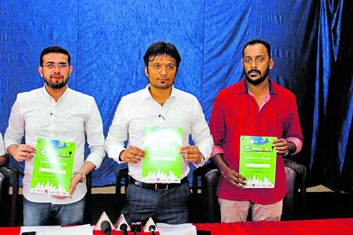 Sahyadri College of Engineering and Management Professor Ananth Prabhu G and others release a pamphlet on e-Swachh Bharat, an e- waste management campaign, in Mangaluru.