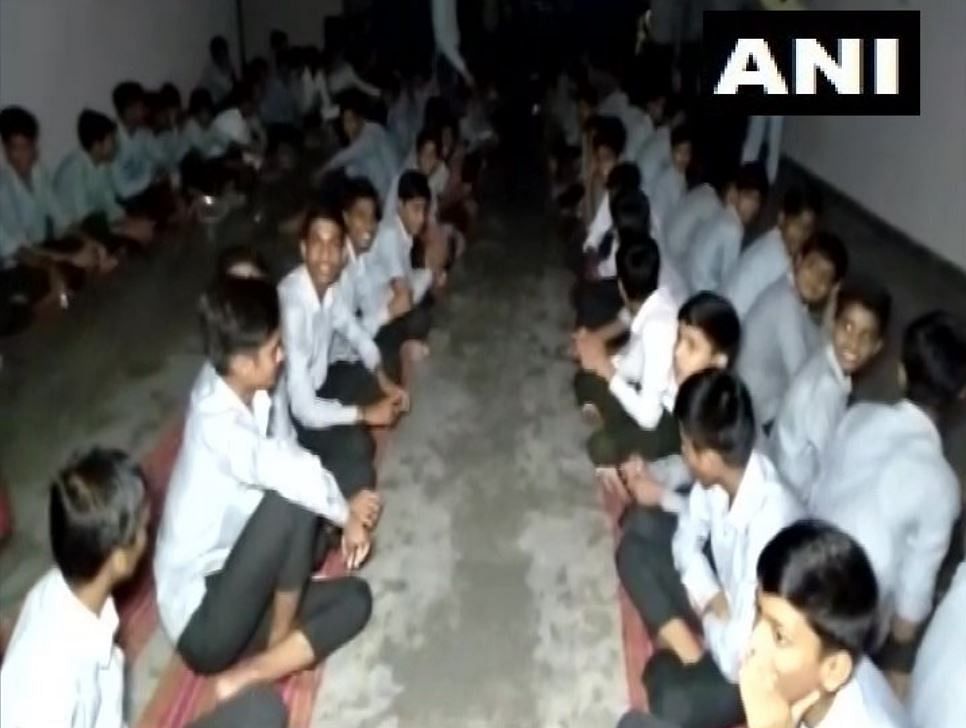 The students got stuck inside the school campus after the roads were blocked due to heavy discharge of water from Rana Pratap Dam. Photo/ANI