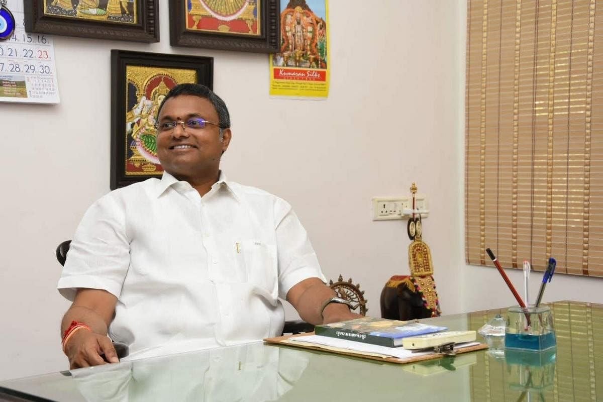Sivaganga MP and former finance minister P Chidambaram's son - Karti Chidambaram - in his office. (DH Photo)