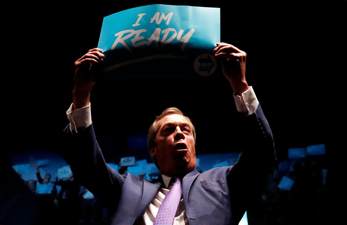 Brexit Party leader Nigel Farage holds a sign during a party event in Southport, Britain, September 13, 2019. (Photo by Reuters)
