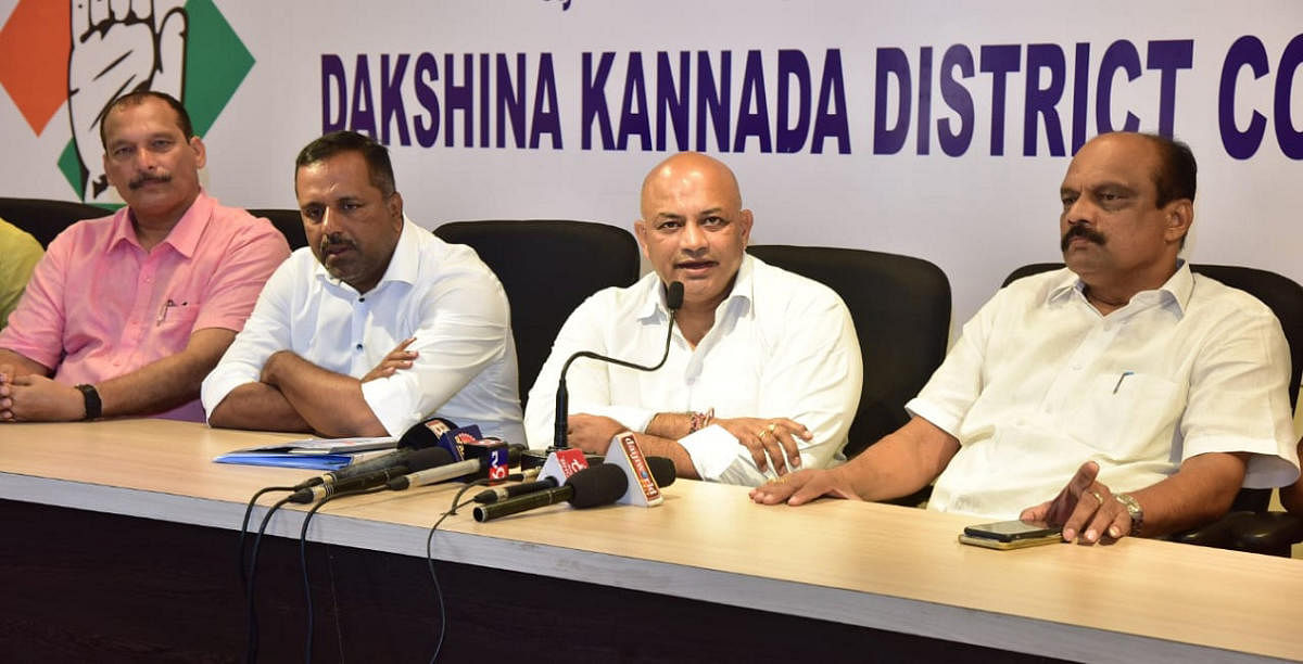 AICC former Secretary Suraj Hegde speaks during a press meet at the District Congress Committee office in Mangaluru on Sunday. Mangaluru MLA U T Khader, Dakshina Kannada District Congress Committee President Harish Kumar and MLC Ivan D'Souza look on.