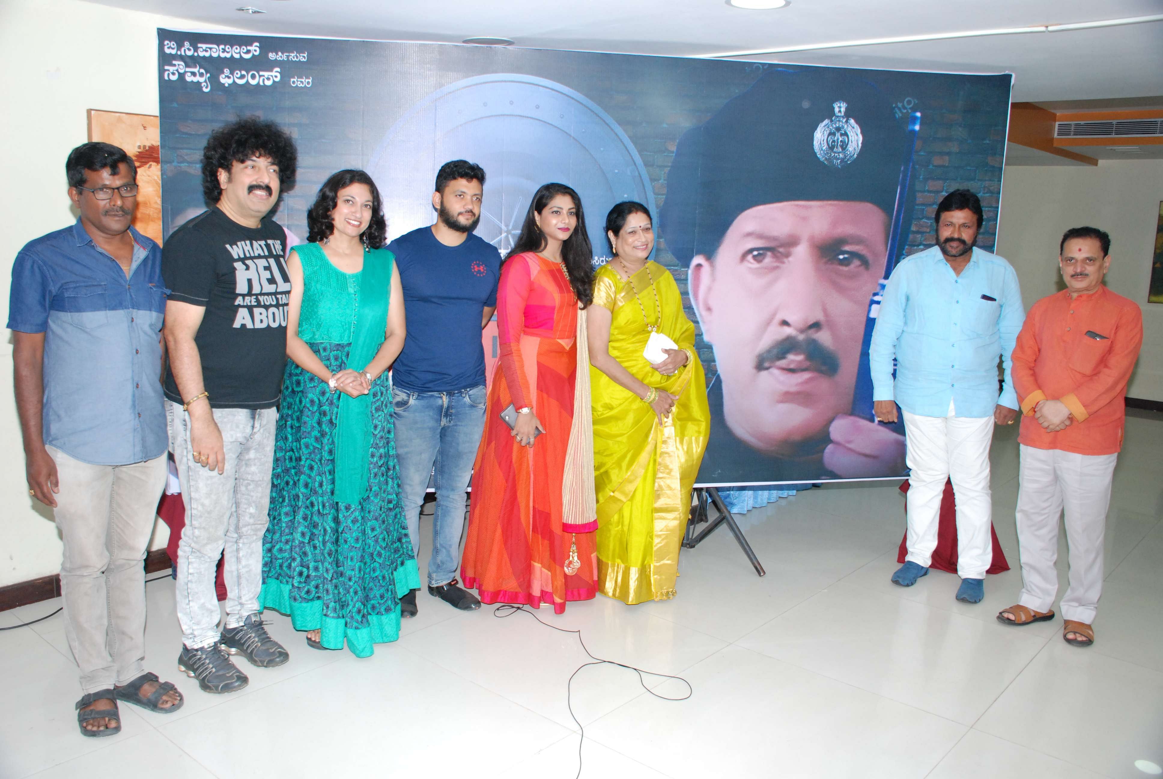 (From left) Editor Eshwar, music director Guru Kiran, actress Suman Nagarkar, Srishti Patil (fifth from left, in red), Vanaja Patil, producer B C Patil and director Sunil Kumar Desai at the announcement of Nishkarsha’s re-release.