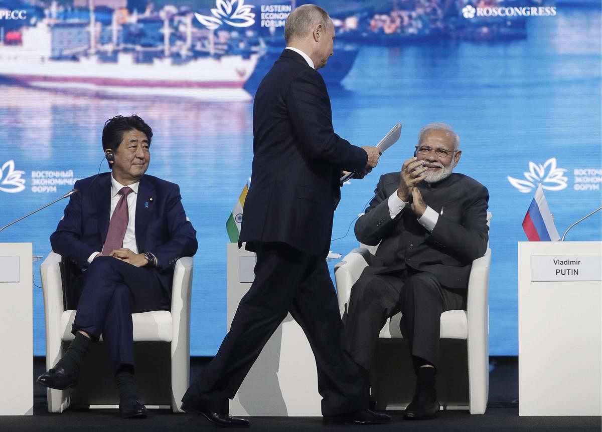 From left, Japanese Prime Minister Shinzo Abe, Russian President Vladimir Putin and India's Prime Minister Narendra Modi attend a plenary session of the Eastern Economic Forum in Vladivostok, Russia, on September 5, 2019. AP/PTI