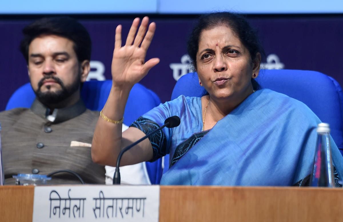 Finance Minister Nirmala Sitharaman speaks during a press conference as MoS Finance Anurag Thakur looks on, in New Delhi, Saturday, Sept. 14, 2019. Sitharaman on Saturday said inflation is under control and there is a clear sign of revival of industrial p