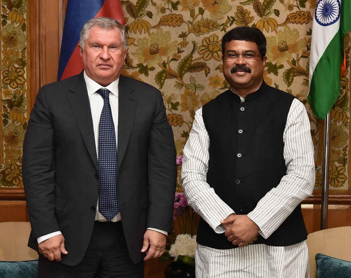 Union Minister for Petroleum, Natural Gas and Steel, Dharmendra Pradhan and Russia's oil company Rosneft chief Igor Sechin pose for a photograph during a meeting, in New Delhi. (PTI Photo)