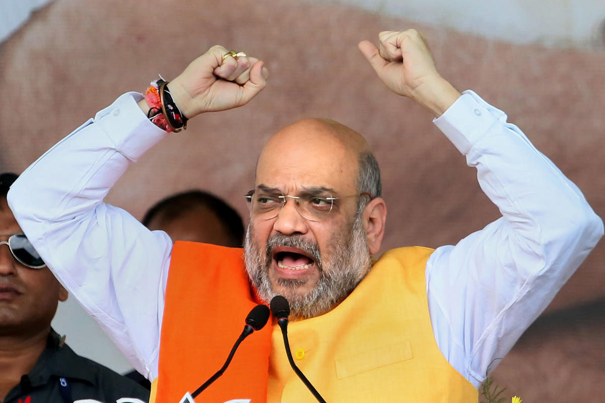 BJP national president and Union Home Minister Amit Shah addresses a rally to begin his Jan Ashirvaad Yatra, ahead of the state Assembly elections, in Jamtara, Wednesday, Sept 18, 2019. (PTI Photo)