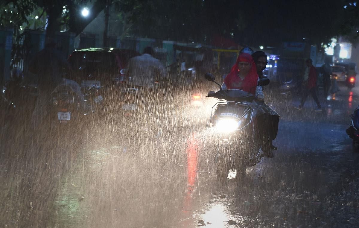 Chennai commuters ride in the rain. (PTI File Photo)
