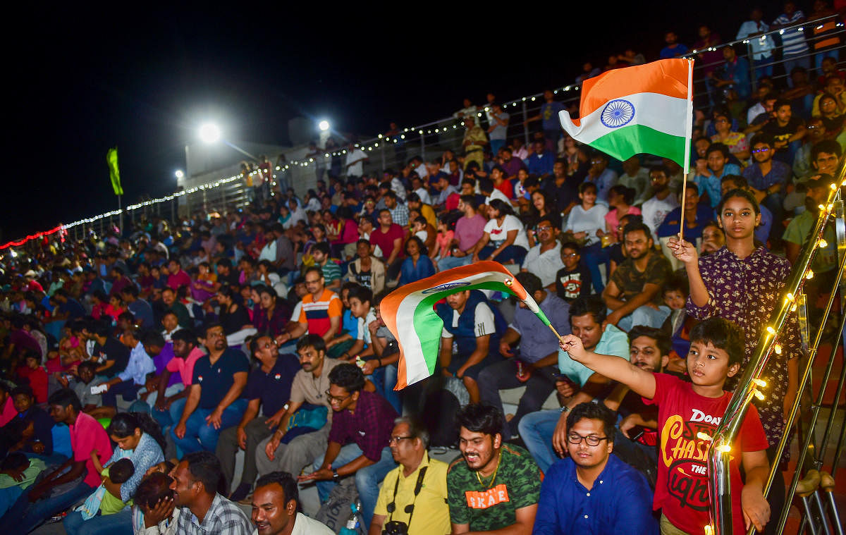 People who gathered at a gallery to witness the launch of Chandrayaan-2 in Sriharikota on Monday. PTI