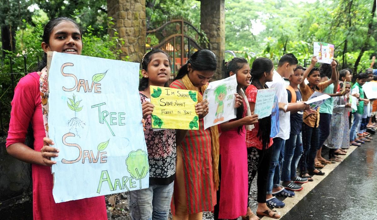 Save Aarey activists and local Mumbaikars participate protesting against cutting Aarey forest. (PTI Photo)