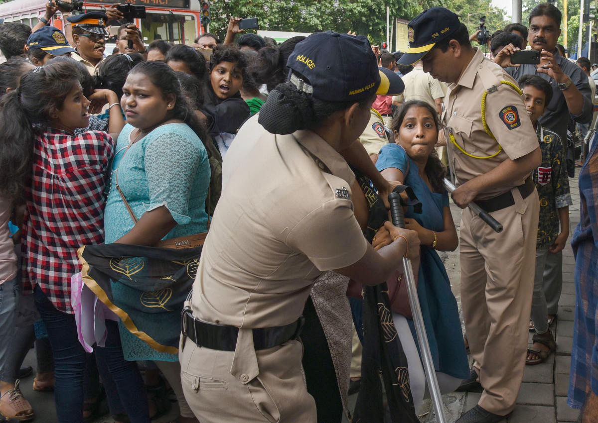 Police personnel detain students during a protest outside Bollywood actor Amitabh Bachchan's residence in Juhu. (PTI Photo)