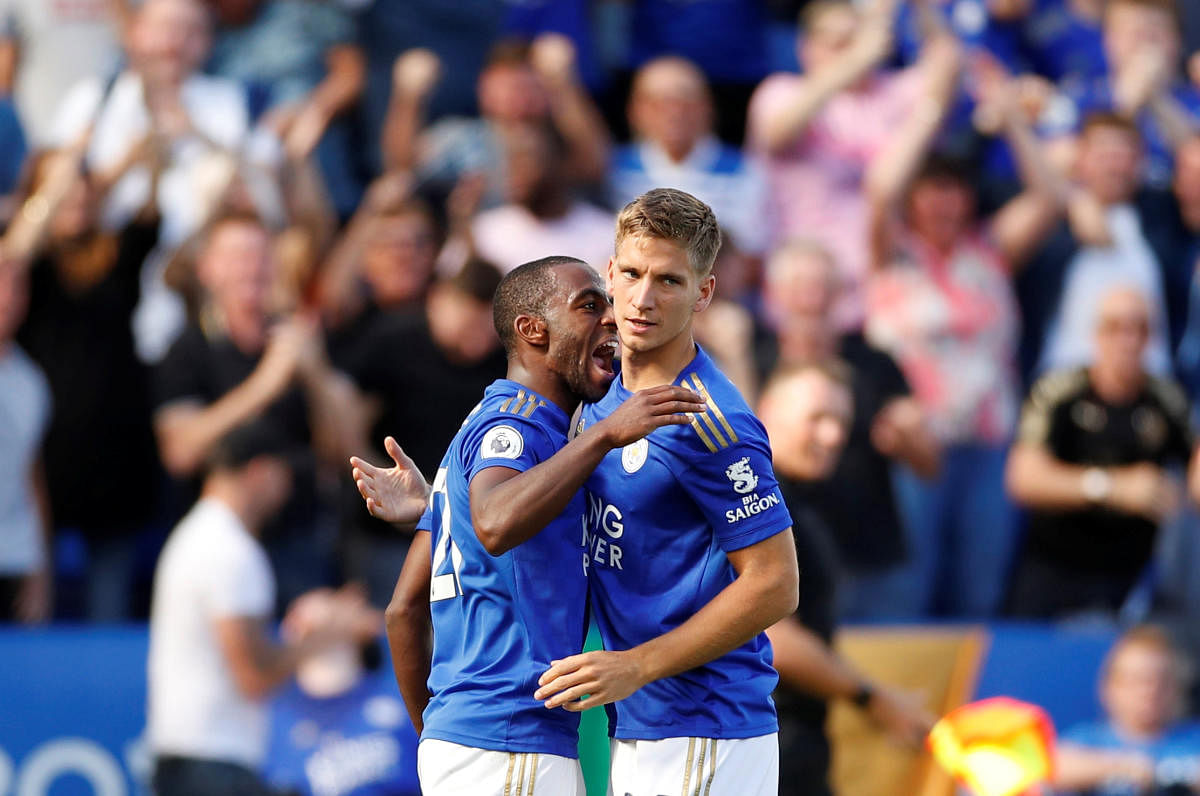 Leicester City's Ricardo Pereira (left) celebrates with Dennis Praet after scoring against Tottenham Hotspur on Saturday. REUTERS 