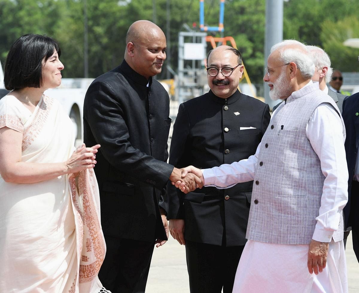 Prime Minister Narendra Modi being received by Indian ambassador to the US Harsh Vardhan Shringla (2nd R) and the officials, on his arrival at George Bush International Airport in Houston, Texas, USA, Saturday, Sept. 21, 2019. (PIB/PTI Photo)