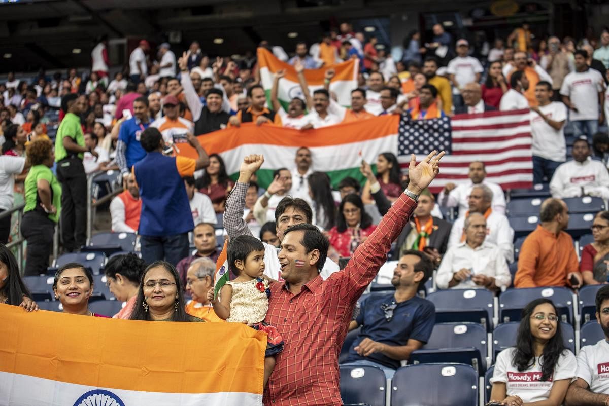 Attendees chant and cheer inside NRG Stadium ahead of a visit by Indian Prime Minister Narendra Modi on September 22, 2019 in Houston, Texas. AFP