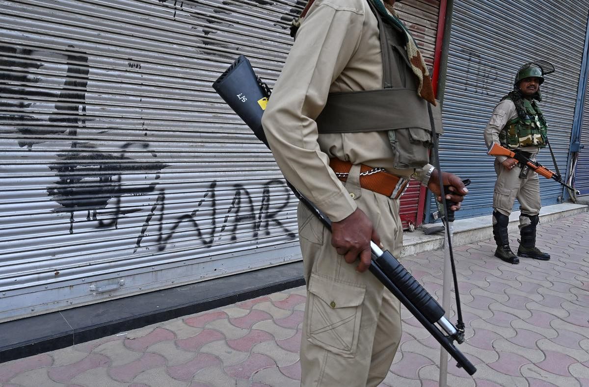 Over the past month, militants have been putting up posters across Kashmir warning people of attacks to deter them from resuming normal life. Photo/AFP