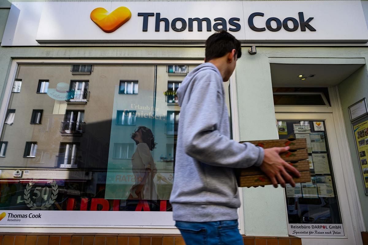As British tour operator Thomas Cook declared bankruptcy, some 600,000 tourists from around Europe had their holidays disrupted. (Photo by John MACDOUGALL / AFP)