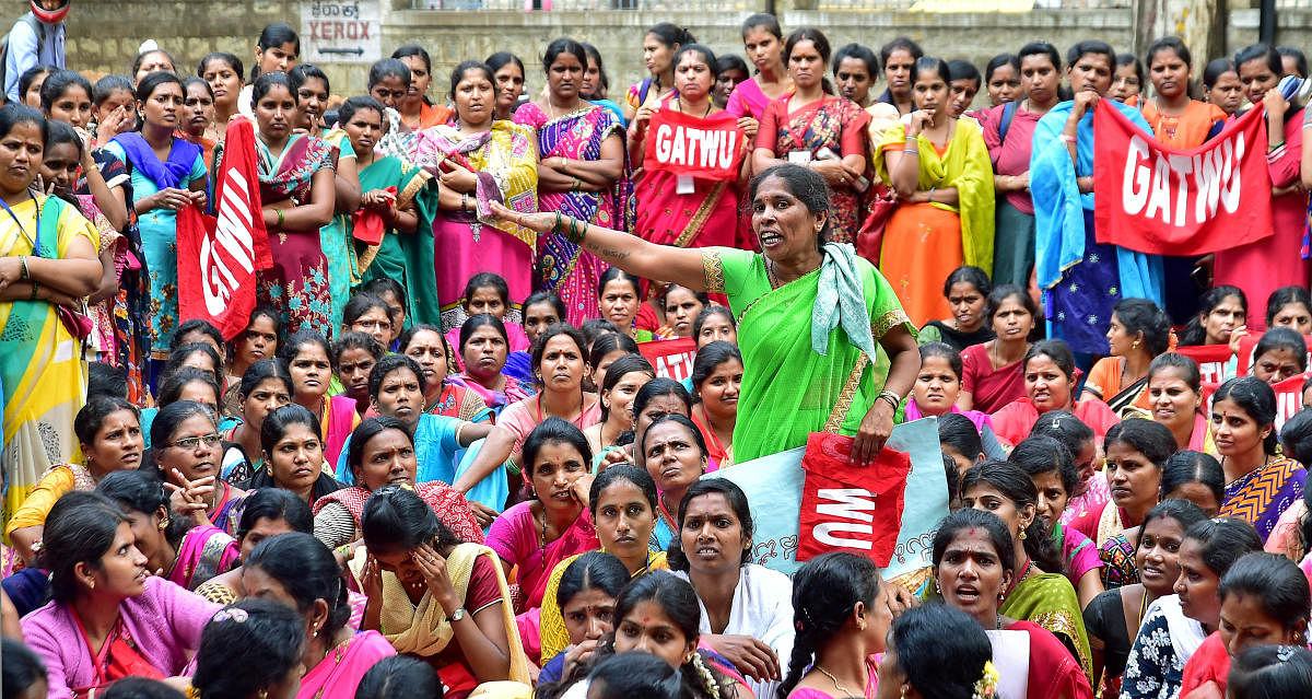 Garment workers at a protest rally organised by the Garments and Textiles Workers Union (GATWU) in Bengaluru . DH Photo