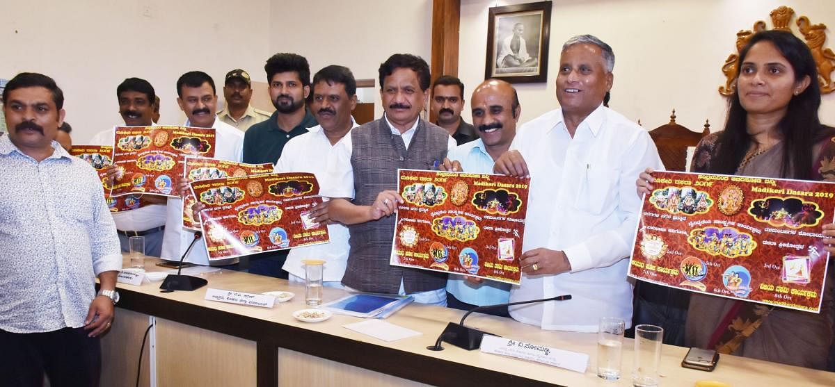 District In-charge Minister V Somanna released the poster of ‘Madikeri Dasara Janotsava 2019’ at the review meeting held at the deputy commissioner’s office in Madikeri on Monday. MP Pratap Simha, MLA Appachu Ranjan, MLA K G Bopaiah and Deputy Commissioner Annies Kanmani Joy look on.
