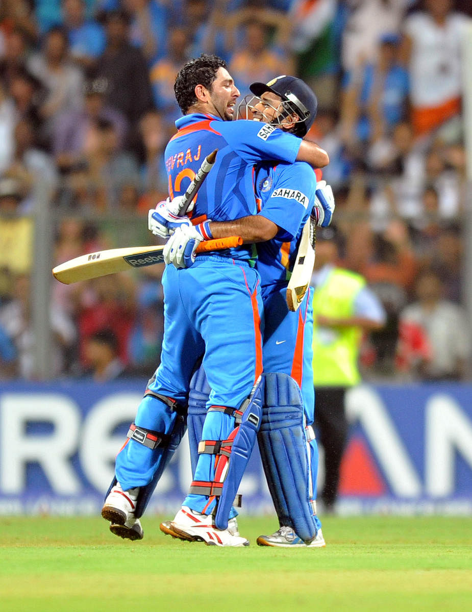Yuvraj and MS Dhoni celebrate by hugging after the winning run in the World cup 2011.