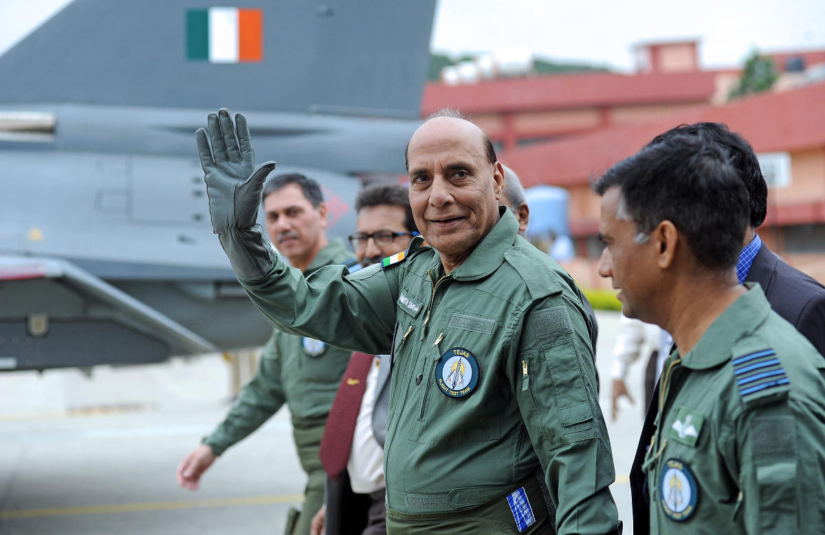 Defence Minister Rajnath Singh prepares to fly in the Tejas fighter aircraft from the HAL airport in Bengaluru on Thursday. | DH Photo: Pushkar V