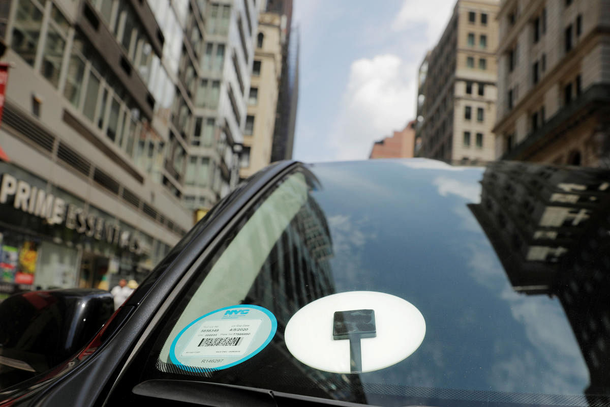 A car with an Uber logo on it (Photo by Reuters)