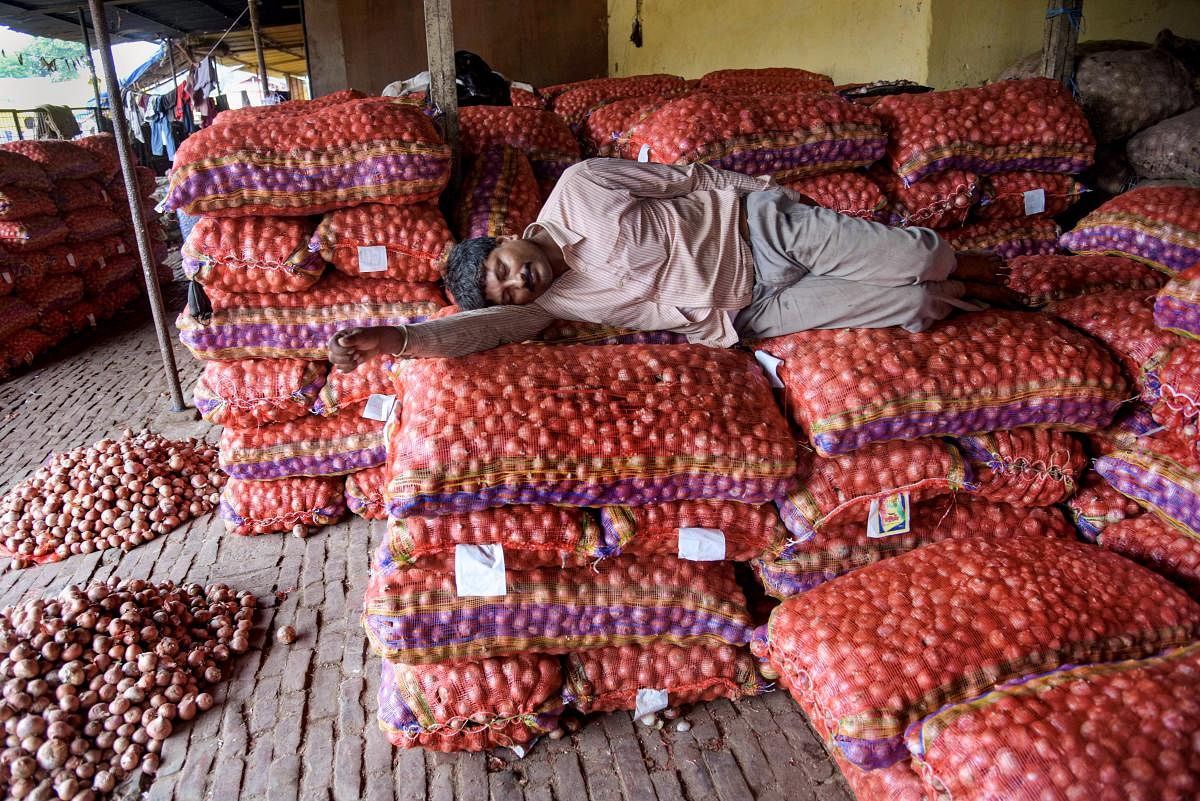 The government will "wait and watch" the price situation for some time for imposing the stock limit as it is equally concerned about the farmers' interest. PTI Photo