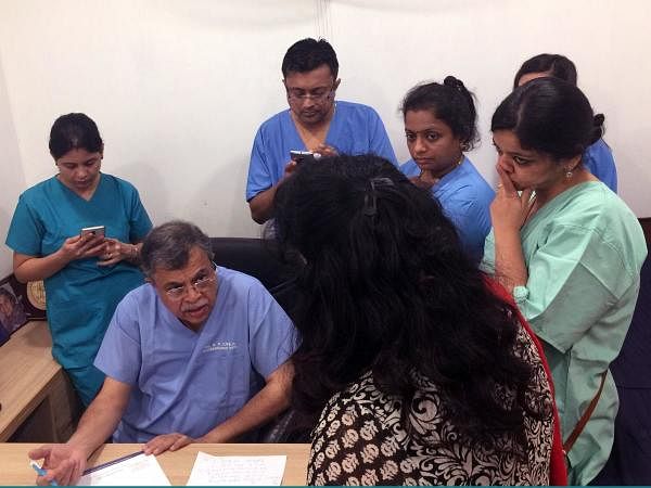 Dr. G P Dureja instructs members of his pain management training program in his East Delhi office. Sarah Varney/KHN