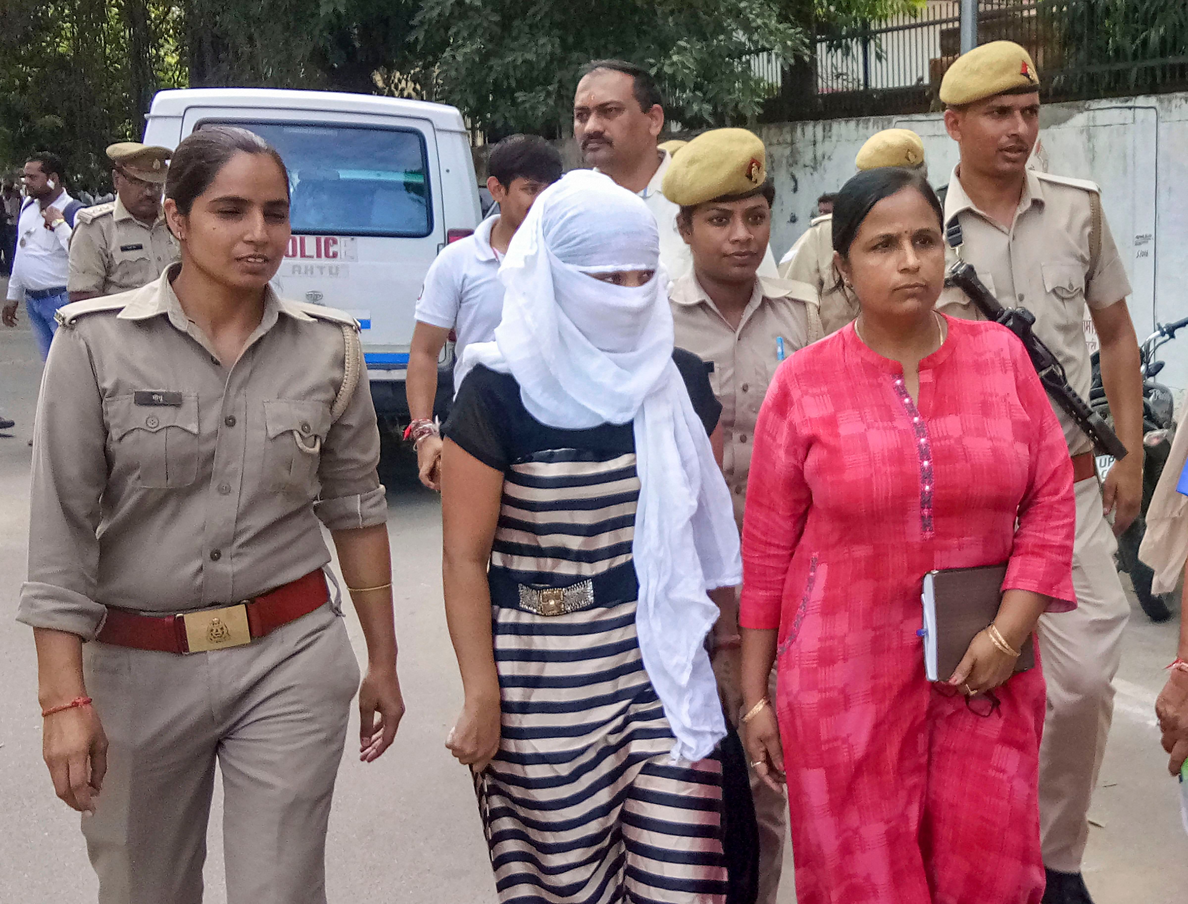 The woman law student, who alleged BJP leader Chinmayanand of sexual misconduct and harassment, outside a local court in Shahjahanpur. (PTI Photo)