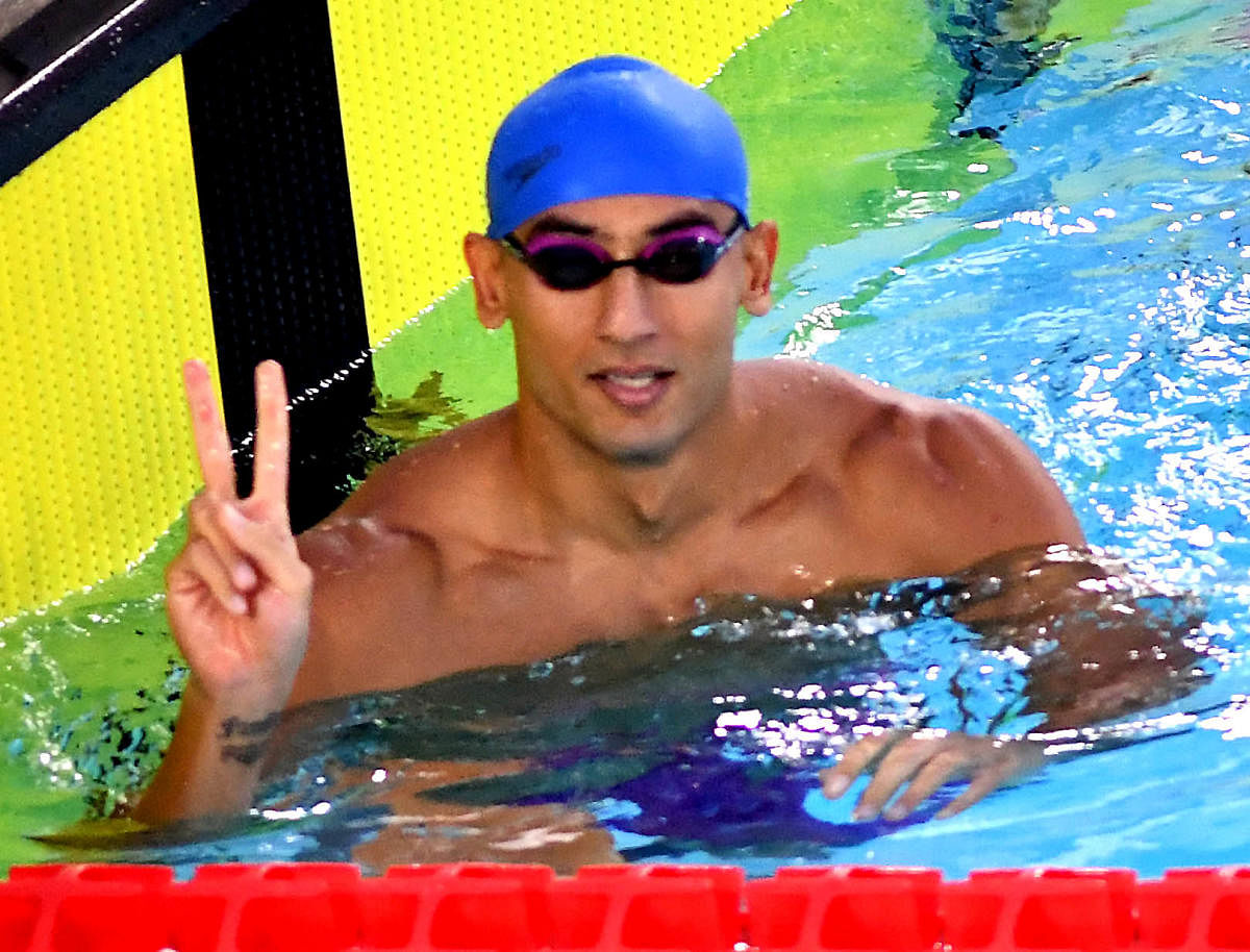 India's Virdhawal Khade celebrates after winning the 50m freestyle in the 10th Asian Age Group swimming championship on Wednesday.DH PHOTO/ SRIKANTA SHARMA R