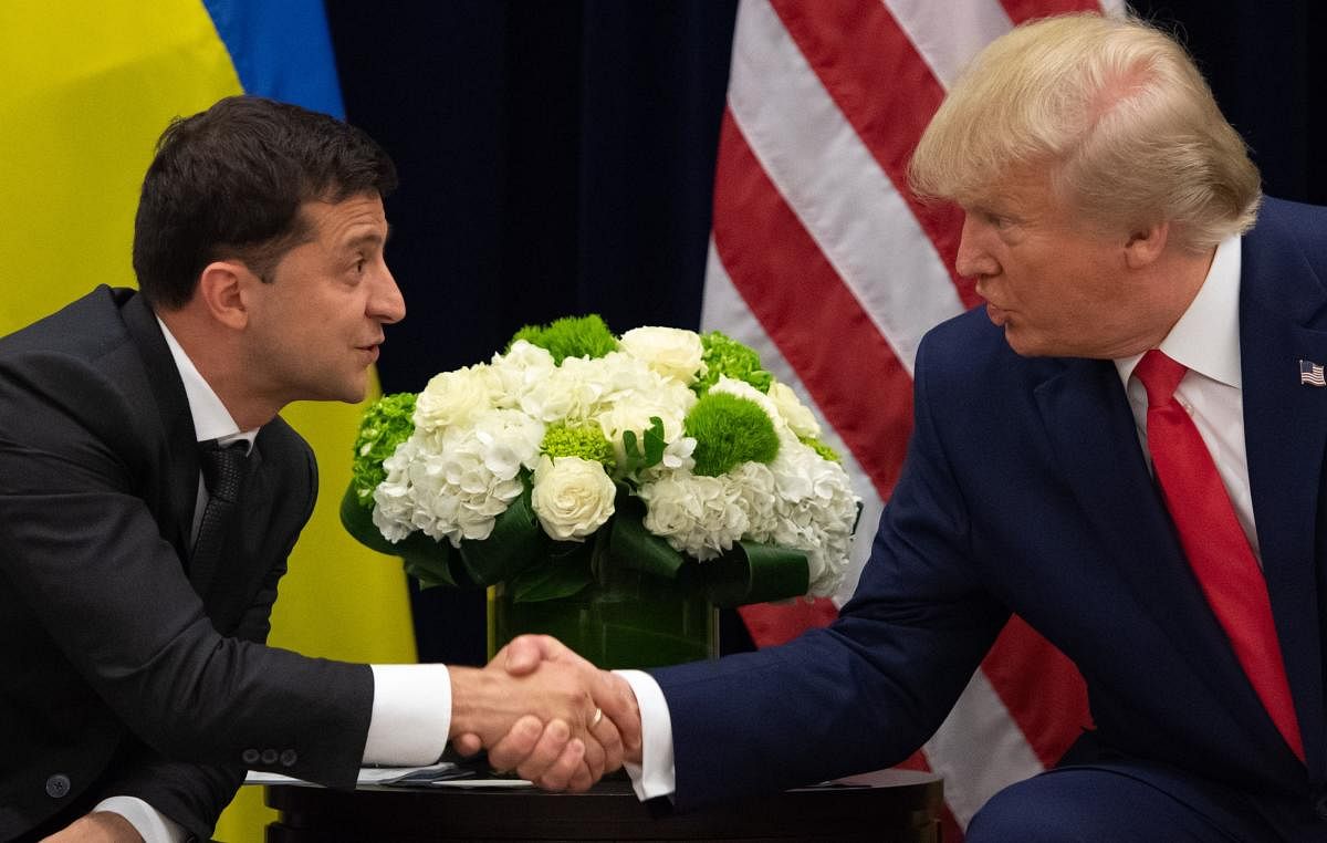 US President Donald Trump and Ukrainian President Volodymyr Zelensky shake hands during a meeting in New York on September 25, 2019, on the sidelines of the United Nations General Assembly. AFP