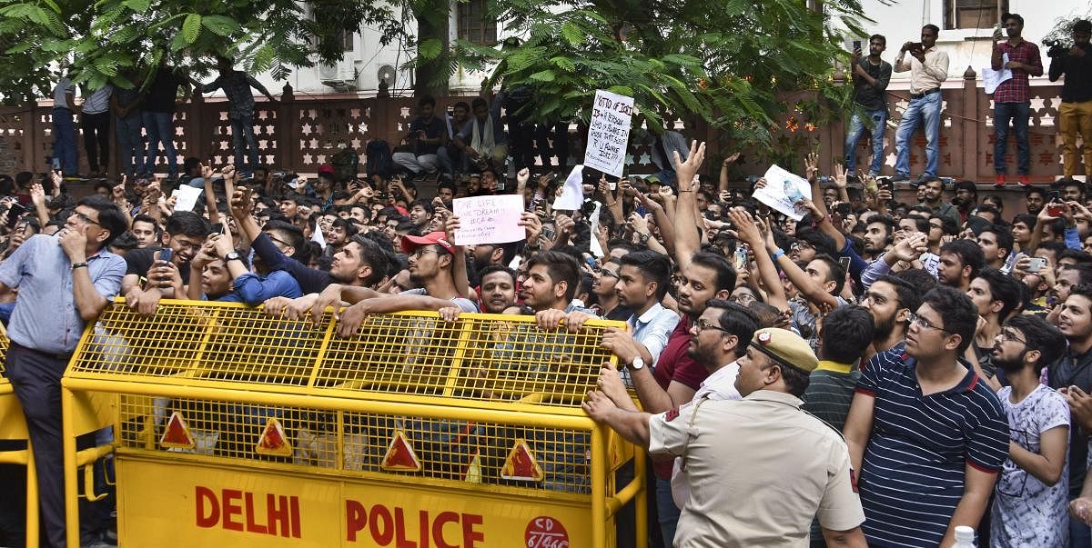 Students of the Institute of Chartered Accountants of India (ICAI) stage a protest outside its office near ITO over alleged improper eveluation of their answer sheets, in New Delhi