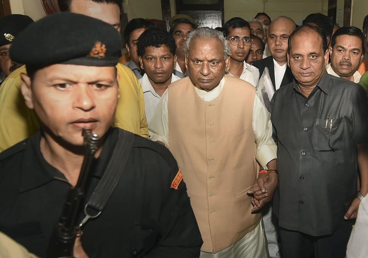  BJP leader and former Uttar Pradesh chief minister Kalyan Singh leaves after appearing before a special CBI court in connection to its summons in the Babri Masjid demolition case, in Lucknow, Friday, Sept. 27, 2019. (PTI Photo/Nand Kumar)