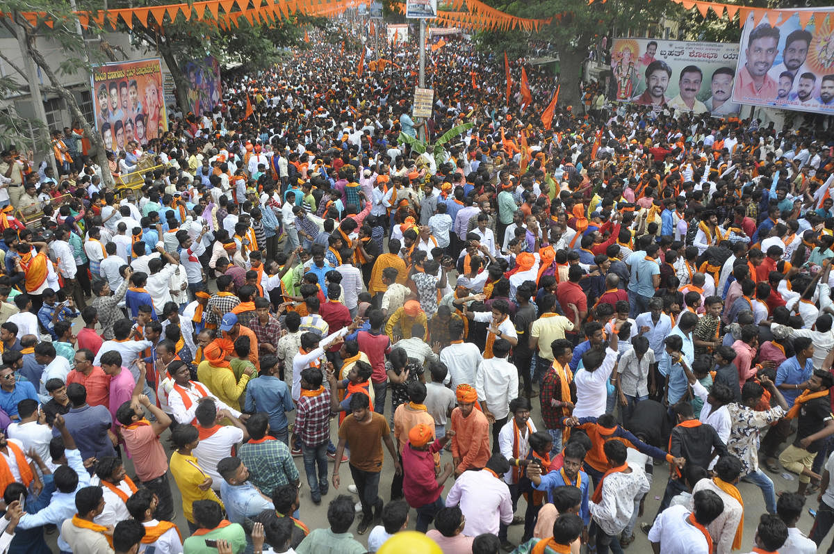 Thousands of people participate in the Shobha Yatra organised as part of the Hindu Mahaganapathy immersion in Chitradurga on Saturday. DH Photo by Bhavani Manju
