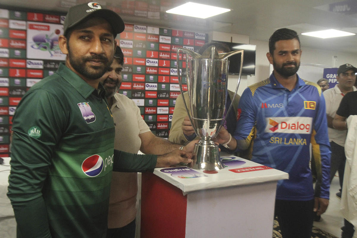  Sri Lanka captain Lahiru Thirimanne, right, and his Pakistani rival Sarfaraz Ahmed stand with a trophy, in Karachi, Pakistan, Thursday, Sept. 26, 2019. Thirimanne wants the focus to move from security in Pakistan to the cricket itself when their three-match ODI series starts Friday. AP/PTI Photo