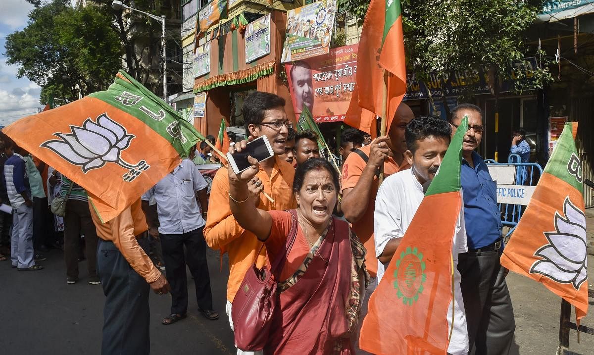 BJP workers raise slogans during a protest rally against the alleged attack on BJP MP Arjun Singh, in Kolkata, Monday, Sept 02, 2019. PTI