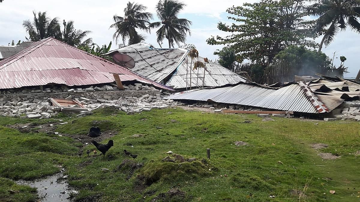 This handout picture taken and released by Indonesia's Badan Nasional Penanggulangan Bencana (BNPB), the accident mitigation agency, on September 27, 2019 shows damaged homes in Ambon, Indonesia's Maluku islands, following a 6.5-magnitude earthquake on Se