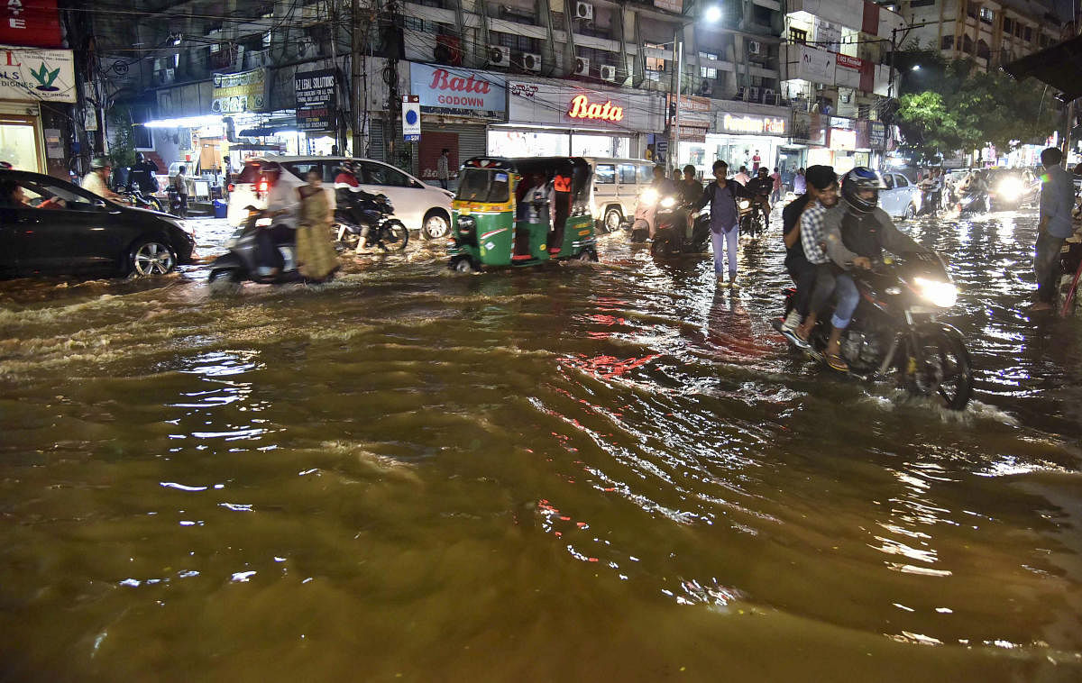 A view of a flooded street at Himayat Nagar, after heavy downpour in Hyderabad. PTI