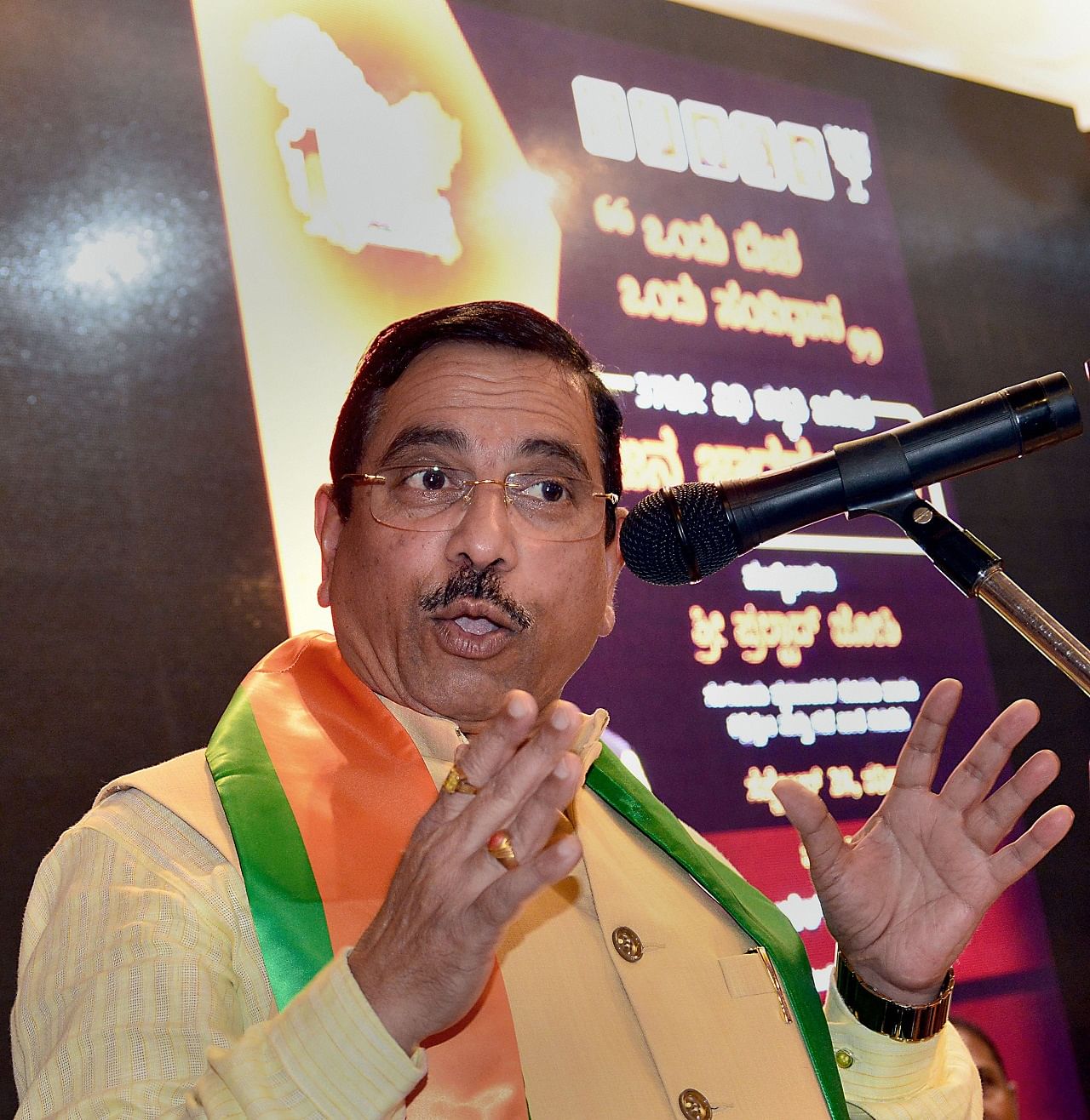 Union Minister for Parliamentary Affairs and Coals and Mines Pralhad Joshi addresses during "Jana Jagaran Sabha" on benefits of abrogating Article 370 in the state of Jammu and Kashmir, in Bengaluru (PTI Photo)